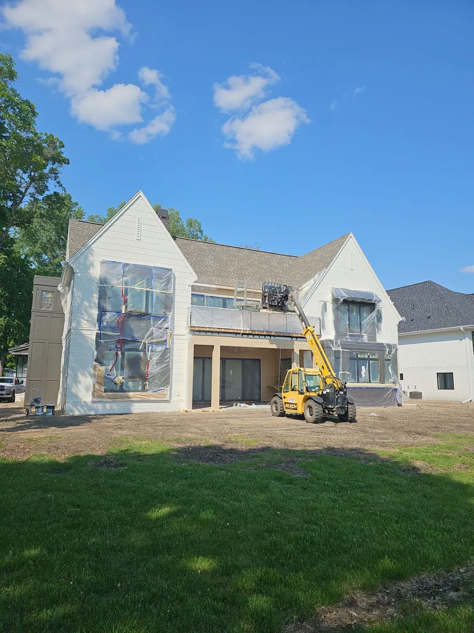 White two-story home during new construction