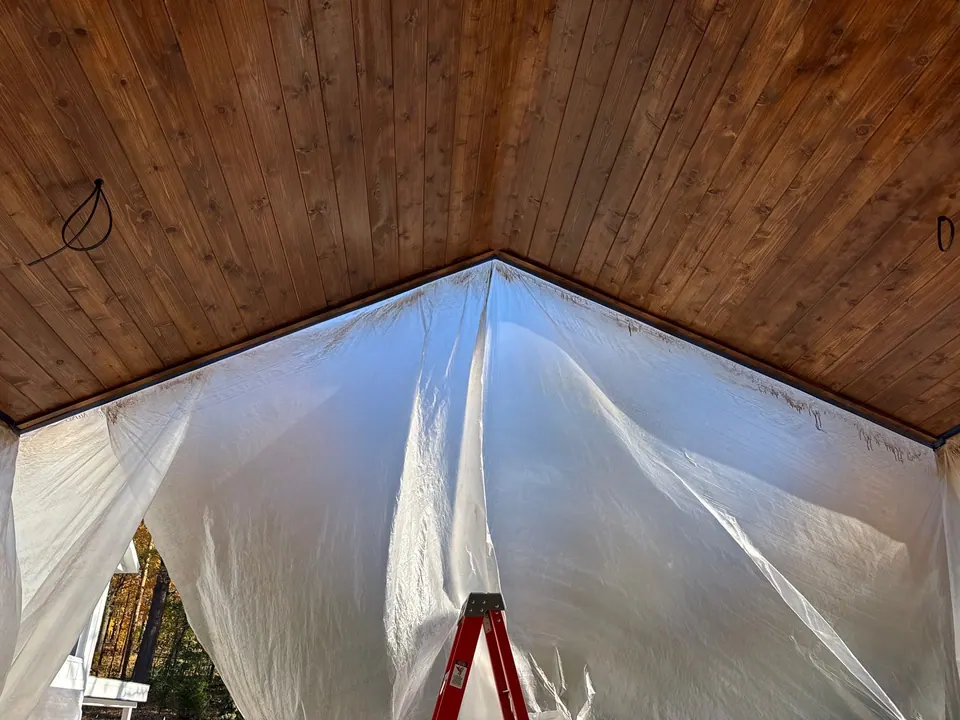 Vaulted tongue-and-groove ceiling masked off for painting